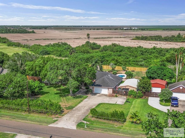 birds eye view of property with a rural view