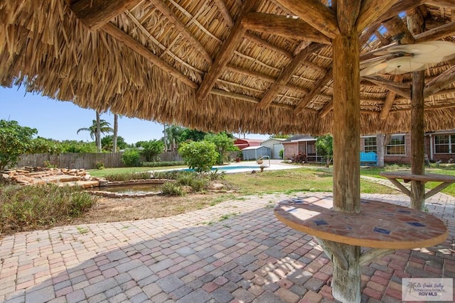 view of patio / terrace featuring a gazebo and an outdoor structure