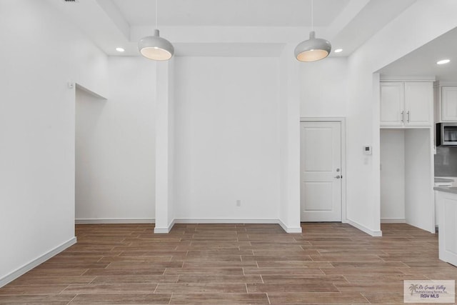 unfurnished dining area with light wood-type flooring