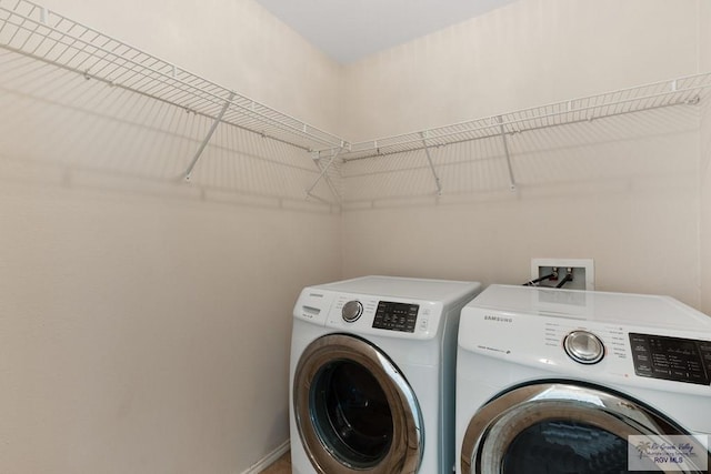 washroom featuring washer and dryer