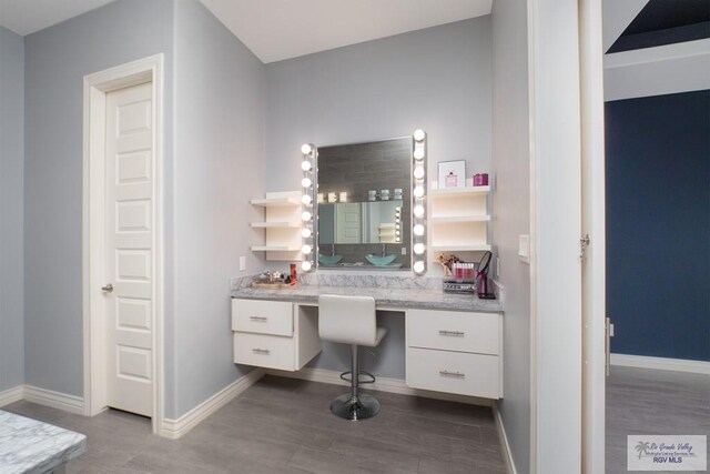 bathroom with vanity and hardwood / wood-style flooring