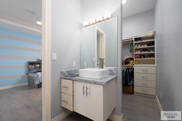 bathroom with vanity and hardwood / wood-style flooring