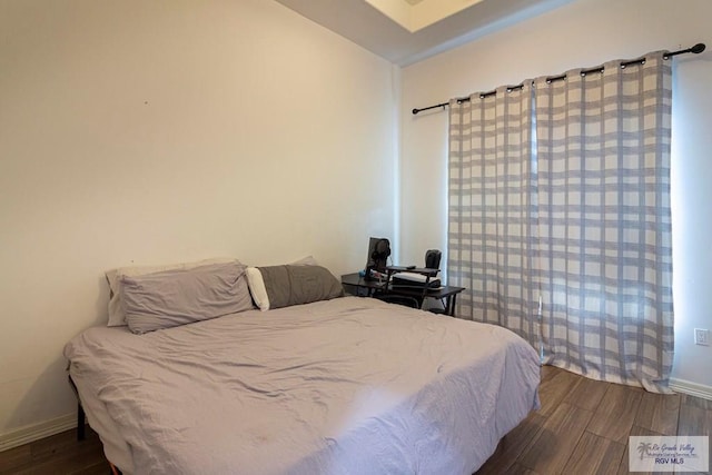 bedroom featuring hardwood / wood-style flooring