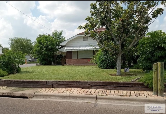 view of home's exterior with a lawn