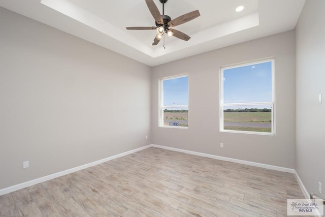 3729 Marco Ave, Harlingen, TX 78550 - unfurnished room featuring a raised ceiling, a ceiling fan, light wood-type flooring, baseboards, and recessed lighting