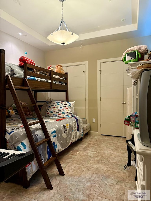 bedroom with a raised ceiling