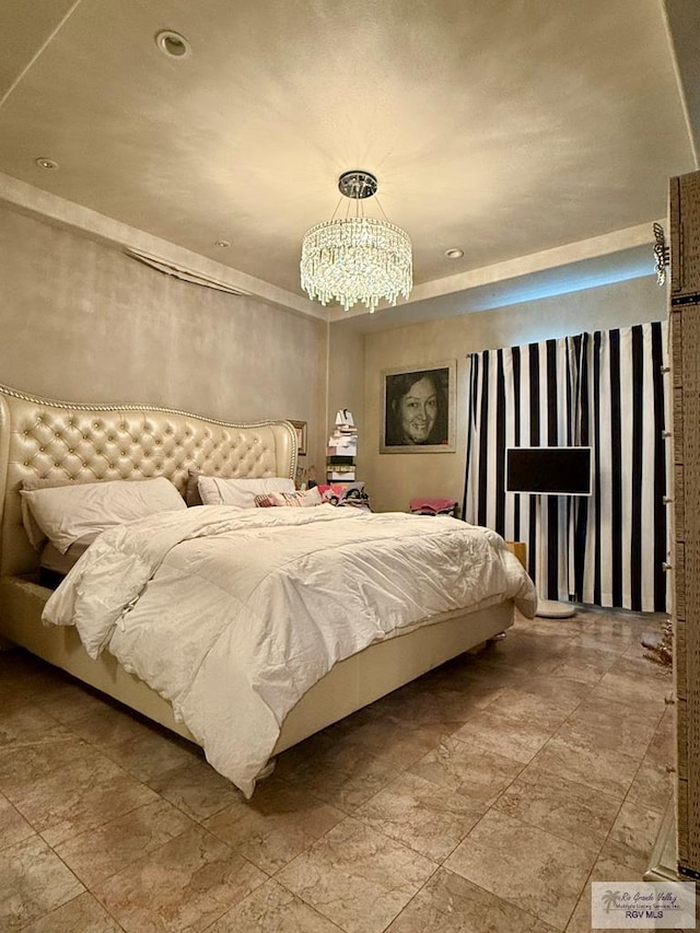 bedroom with a chandelier