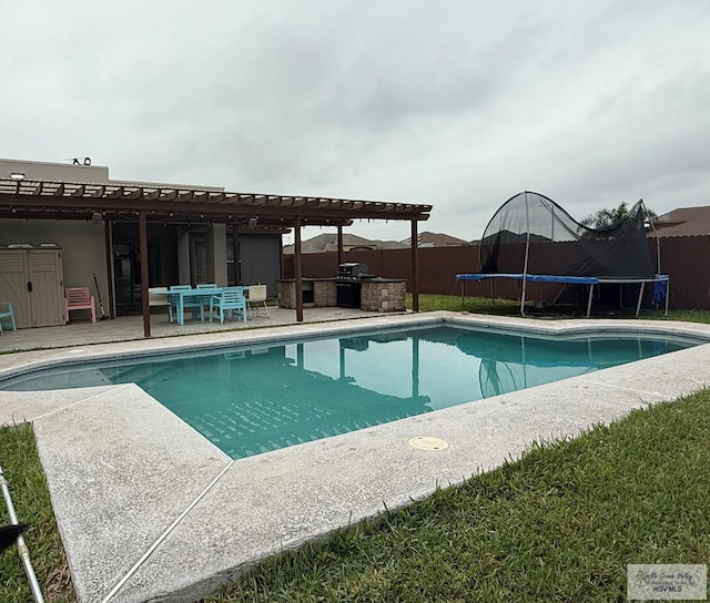 view of pool featuring a trampoline, area for grilling, and a patio area