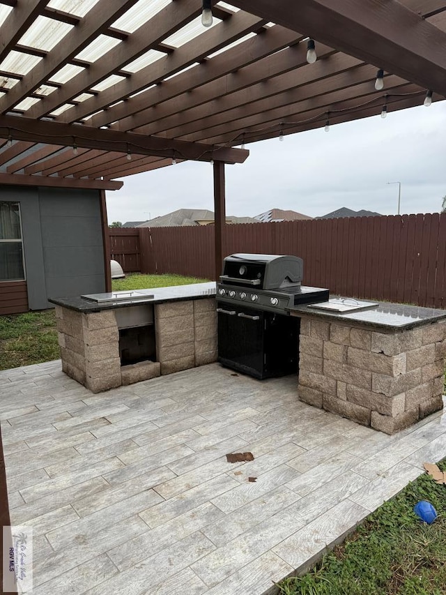 view of patio / terrace featuring a mountain view, a pergola, and area for grilling