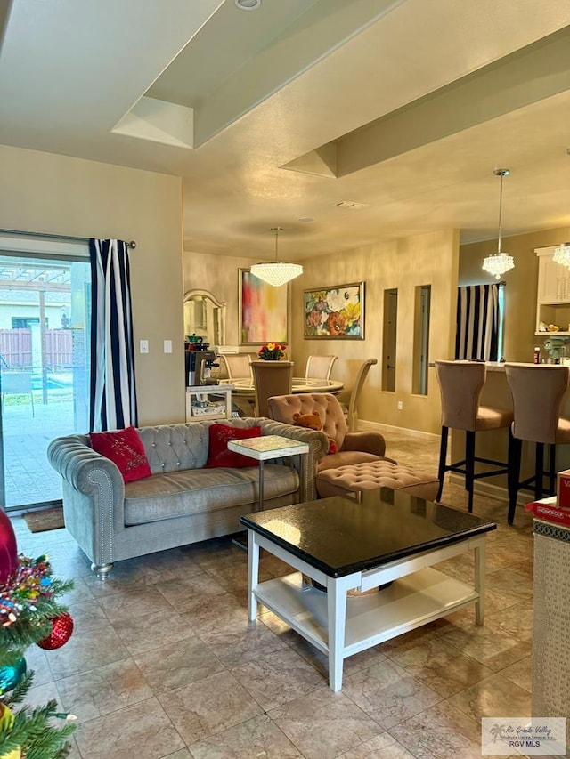 living room with an inviting chandelier