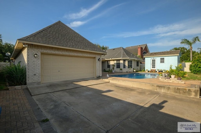 212 E Xenops Ave, Mcallen, TX 78504 - view of swimming pool with an outdoor structure