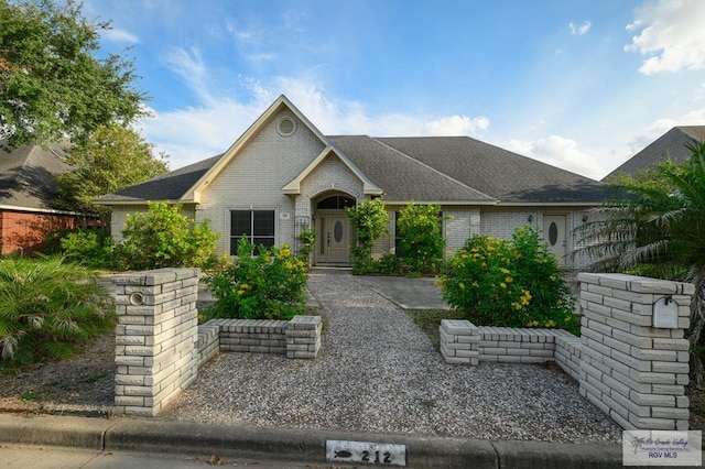 212 E Xenops Ave, Mcallen, TX 78504 - view of front of property with brick siding