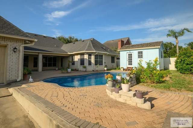 212 E Xenops Ave, Mcallen, TX 78504 - view of pool with a patio area and an outbuilding