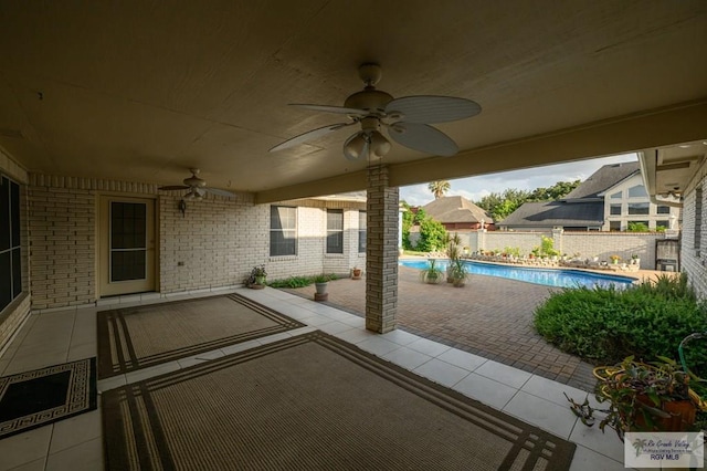 212 E Xenops Ave, Mcallen, TX 78504 - fenced backyard with a ceiling fan and a patio area