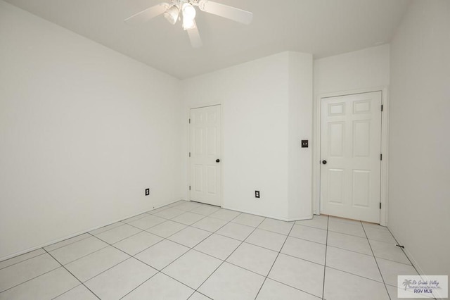 212 E Xenops Ave, Mcallen, TX 78504 - empty room featuring light tile patterned floors and ceiling fan