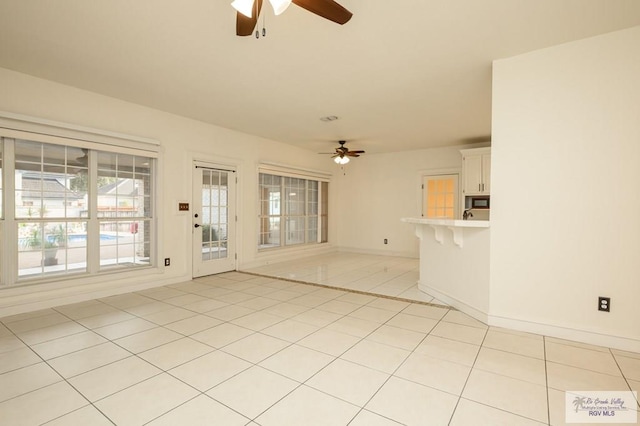 212 E Xenops Ave, Mcallen, TX 78504 - empty room with ceiling fan and light tile patterned floors