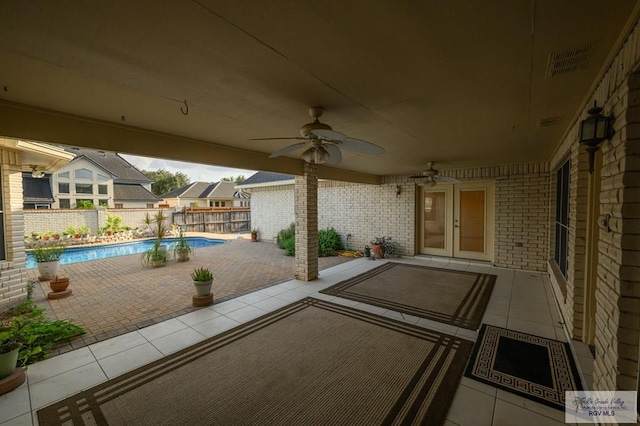 212 E Xenops Ave, Mcallen, TX 78504 - fenced backyard with a patio area and a ceiling fan