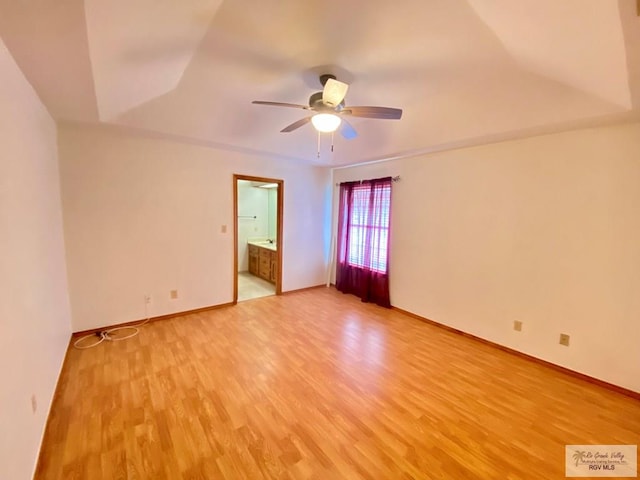 empty room with ceiling fan and light wood-type flooring