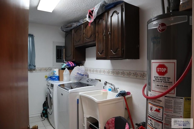 laundry room featuring sink, cabinets, water heater, a textured ceiling, and washer and dryer