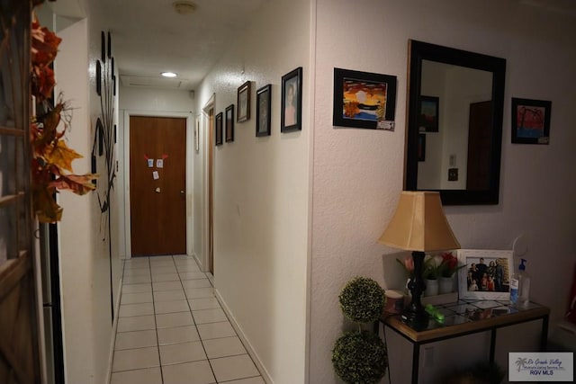 hallway featuring light tile patterned flooring