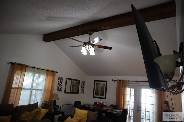 living room featuring vaulted ceiling with beams, ceiling fan, french doors, and a textured ceiling