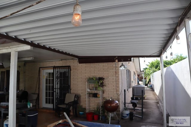 view of patio with grilling area and central AC unit