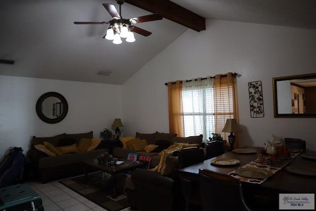 living room featuring ceiling fan, light tile patterned flooring, and lofted ceiling with beams