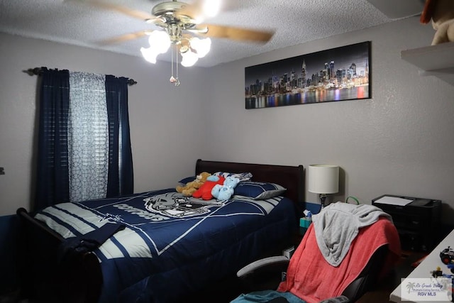 bedroom with a textured ceiling and ceiling fan