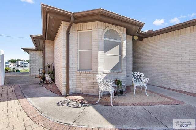 entrance to property featuring a patio