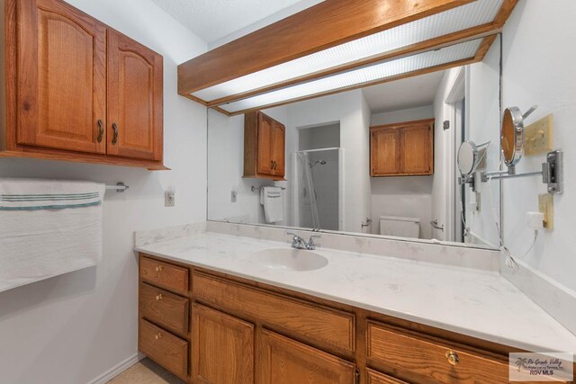 bathroom with a shower with curtain, vanity, and toilet