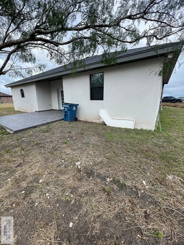 rear view of property with a patio