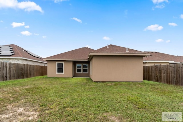 9725 Hawk Dr, Harlingen, TX 78552 - back of property featuring stucco siding and roof with shingles