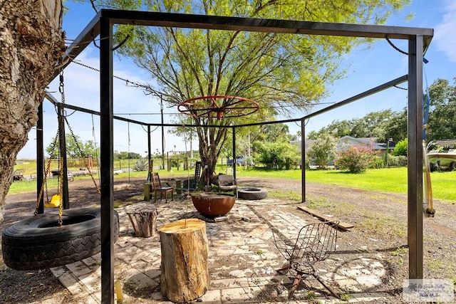 28880 Bass Blvd, Harlingen, TX 78552 - view of patio featuring an outdoor fire pit