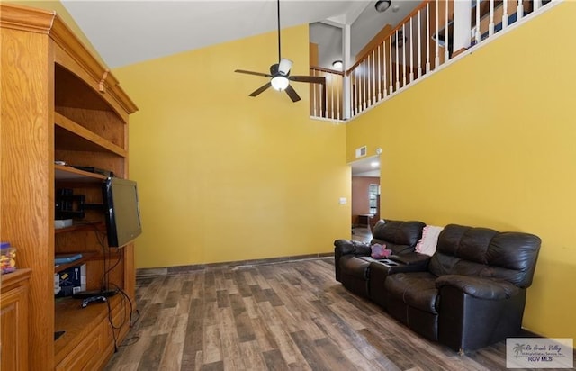 28880 Bass Blvd, Harlingen, TX 78552 - living room featuring ceiling fan, dark wood-style flooring, and a high ceiling