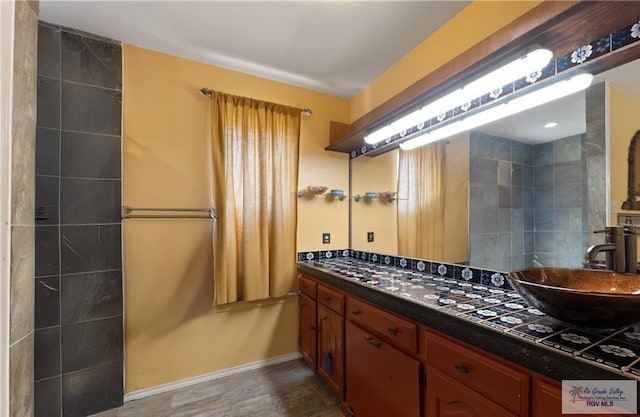 28880 Bass Blvd, Harlingen, TX 78552 - bathroom featuring double vanity and wood finished floors