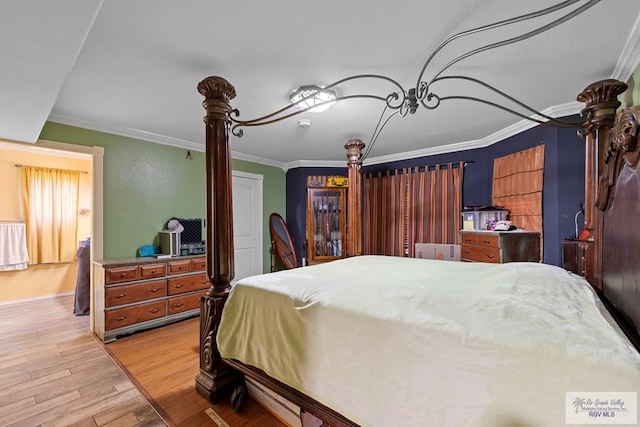 28880 Bass Blvd, Harlingen, TX 78552 - bedroom featuring wood finished floors and crown molding