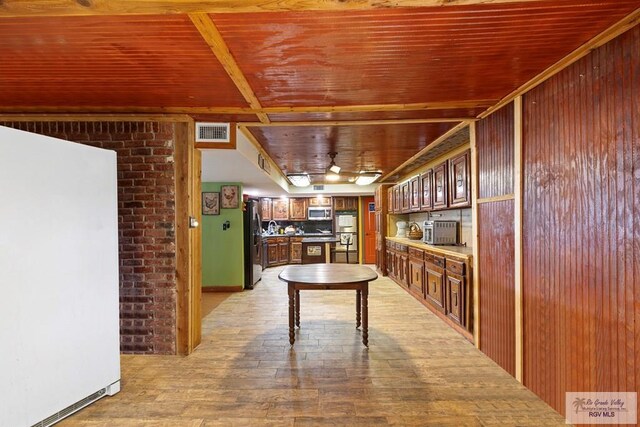 28880 Bass Blvd, Harlingen, TX 78552 - unfurnished dining area featuring light wood finished floors and wooden ceiling