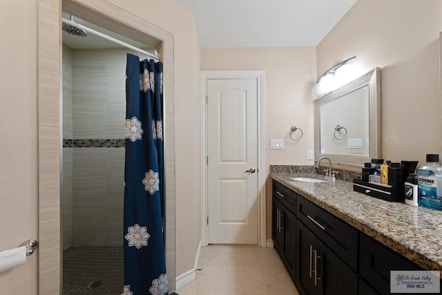 bathroom featuring vanity, tile patterned flooring, and a shower with shower curtain