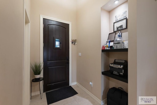 entryway featuring light tile patterned floors