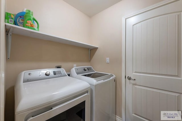 laundry room featuring washing machine and dryer