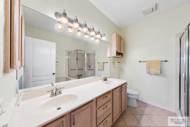 bathroom with a stall shower, tile patterned flooring, visible vents, and a sink