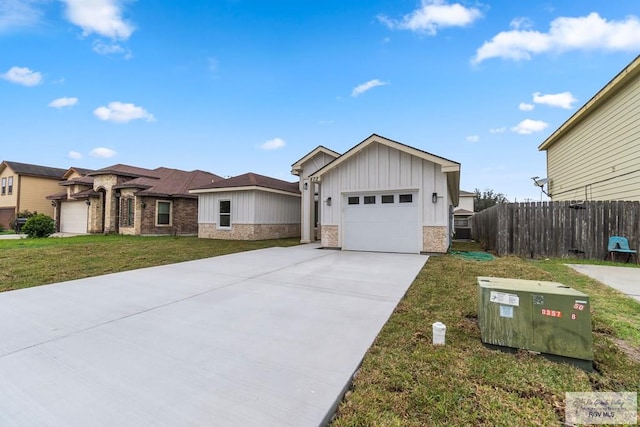 view of front of home with a garage and a front lawn