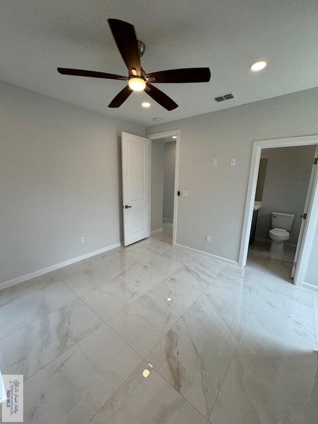 unfurnished bedroom with ensuite bath and ceiling fan