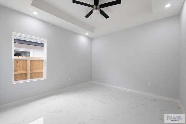 spare room with ceiling fan