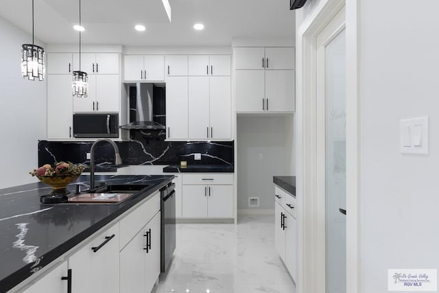 kitchen featuring sink, wall chimney range hood, backsplash, decorative light fixtures, and white cabinets