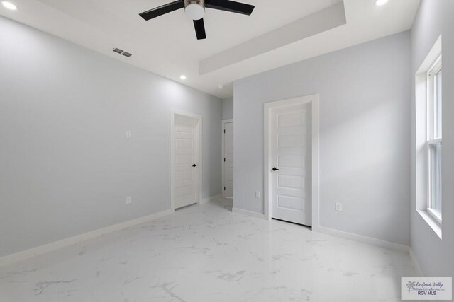 unfurnished bedroom featuring ceiling fan