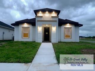 view of front of home with a front lawn