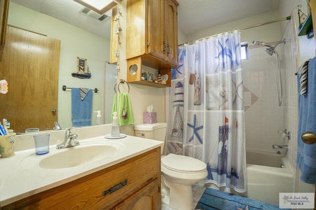 full bathroom featuring toilet, vanity, and shower / bath combo