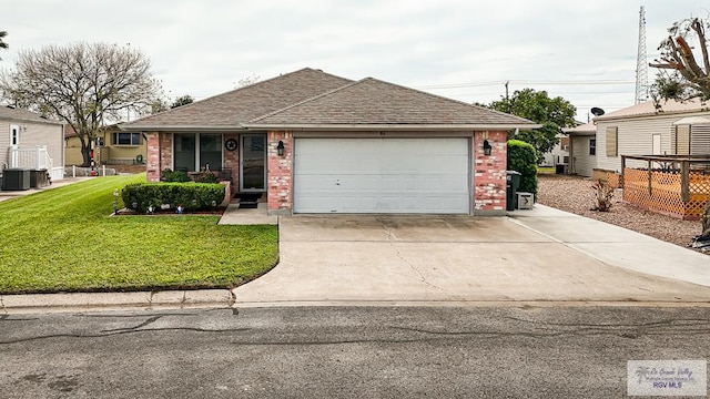 view of front of house with a garage and a front yard