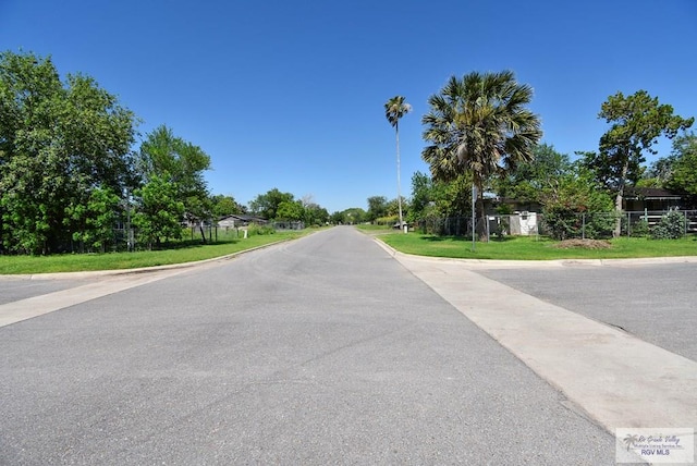 195 W 3rd St, Sebastian, TX 78594 - view of asphalt road with curbs
